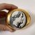 FORNASETTI, Stone paperweight, porcelain man&#39;s head decoration     