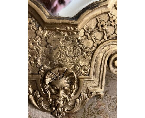 Mirror in chiseled bronze     