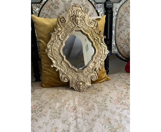 Mirror in chiseled bronze     