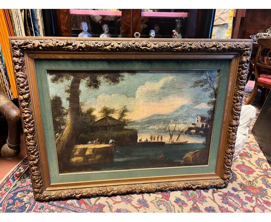 Pittore del XVIII secolo. Paesaggio fluviale con barche e figure. Olio su tela, cm 60x90.