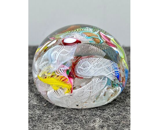 Press-papier paperweight in submerged glass with murrine, retortoli, spirals and silver leaf inclusions.     