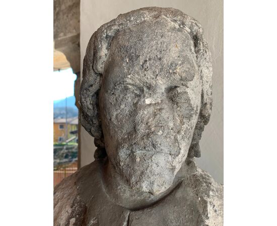 Ancient marble sculpture depicting a pilgrim from the high ages     
