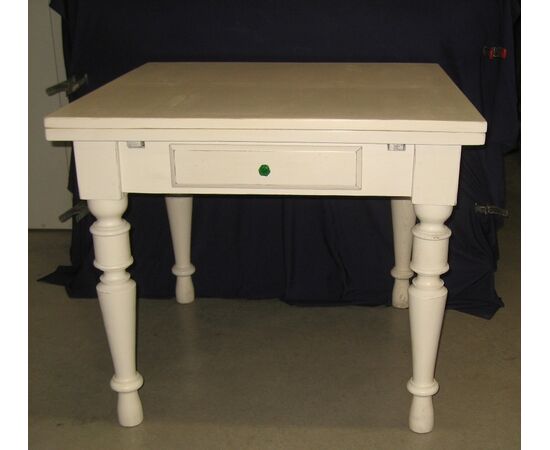 Extendable table with antique lacquered pulls     