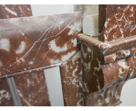 Antique fireplace in red marble from France.     