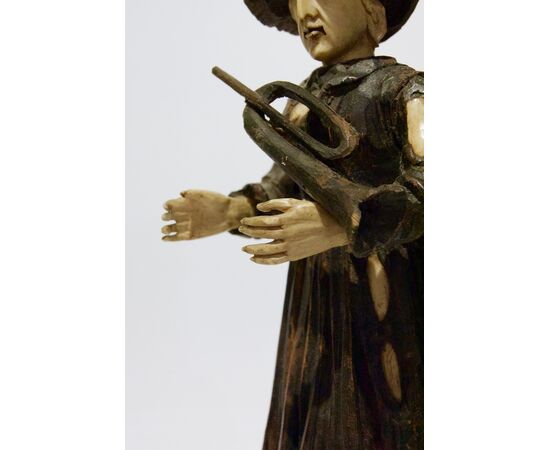 German manufacture, Early 19th Century, Beggar with wooden trumpet, bone and transparent plexiglass base     