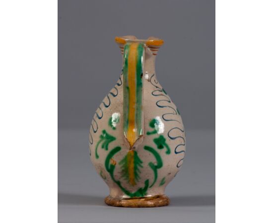Pesaro, Late 16th century, Pitcher with apple within a vegetable shoot in polychrome majolica     