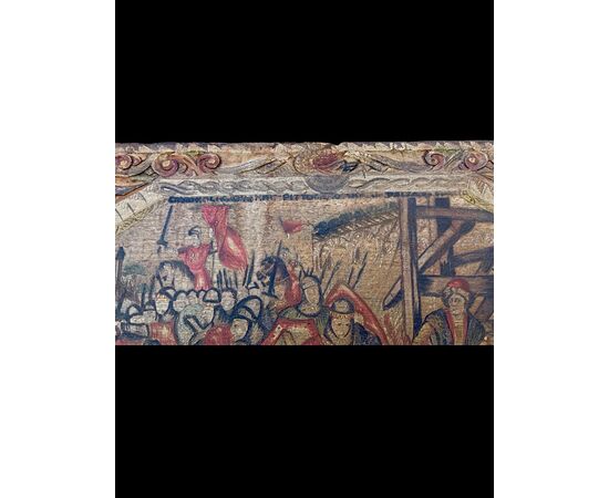 Pannello ricavato da fianco di carretto siciliano in legno dipinto con scene di battaglia.