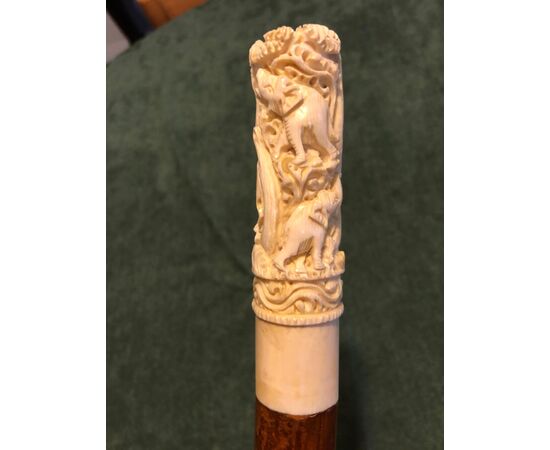 Stick with ivory knob engraved with elephants and tiger. Bamboo cane.     