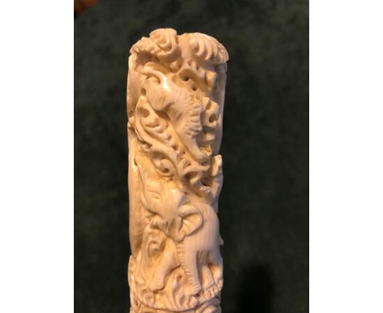 Stick with ivory knob engraved with elephants and tiger. Bamboo cane.     
