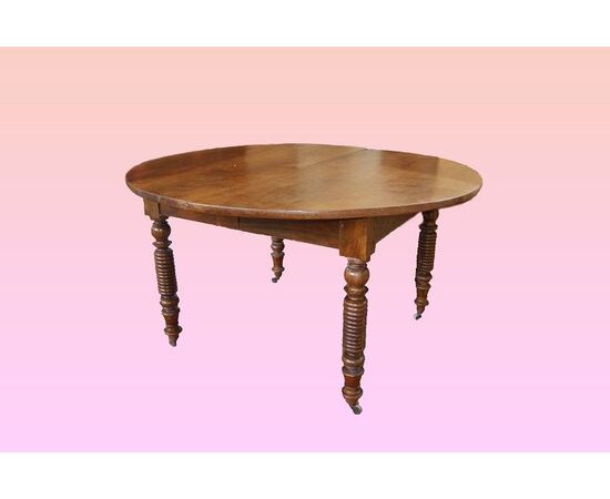 Tavolo circolare allungabile francese di inizio 1800 in legno di noce 