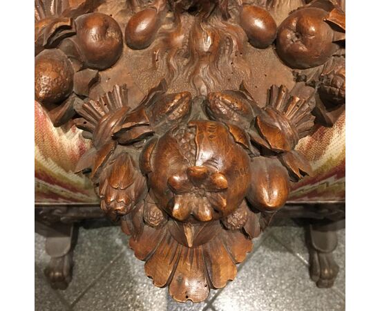 Carved walnut shelf depicting a satyr&#39;s head     