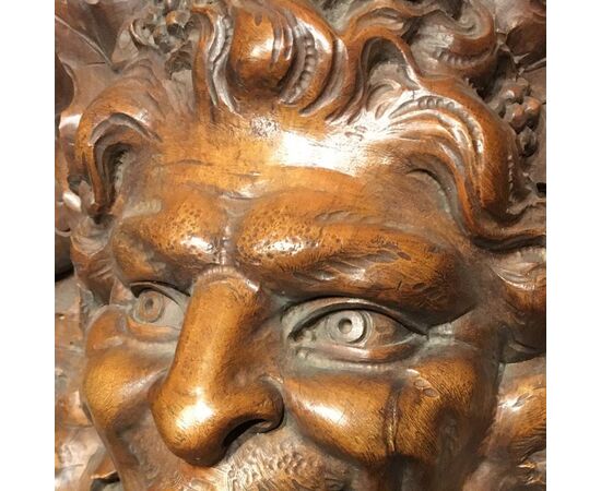 Carved walnut shelf depicting a satyr&#39;s head     