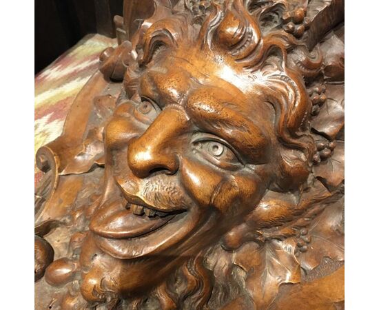 Carved walnut shelf depicting a satyr&#39;s head     