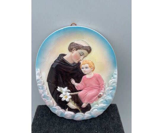 Polychrome earthenware tile with the figure of Saint Anthony of Padua and the Child Jesus Ronzan Manufacture, Turin.     