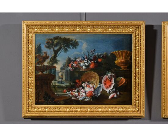 Coppia di dipinti raffiguranti Nature morte composizione di fiori e anguria e giardino sullo sfondo, Francesco Lavagna (Napoli 1684-1724) 