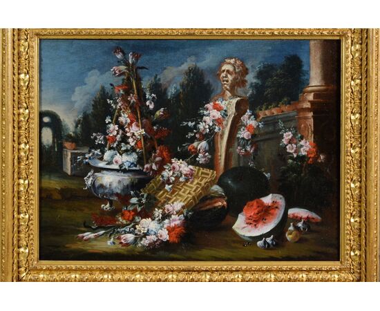 Natura morta con composizione di fiori e anguria ed erma con giardino sullo sfondo, Francesco Lavagna (Napoli 1684-1724)