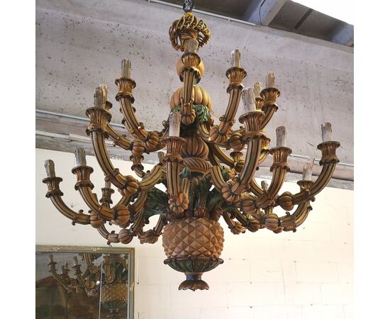 Large and particular chandelier in carved and lacquered wood     
