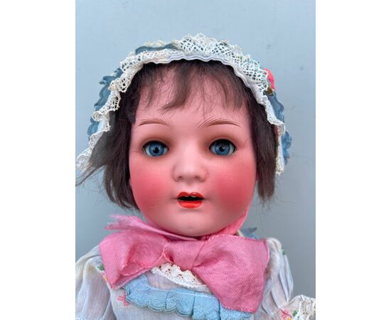 Bebe&#39;caractère doll with bisque head and papier-mâché body.Moving eyes.Signature Heuback Koppeldorf.Germany     