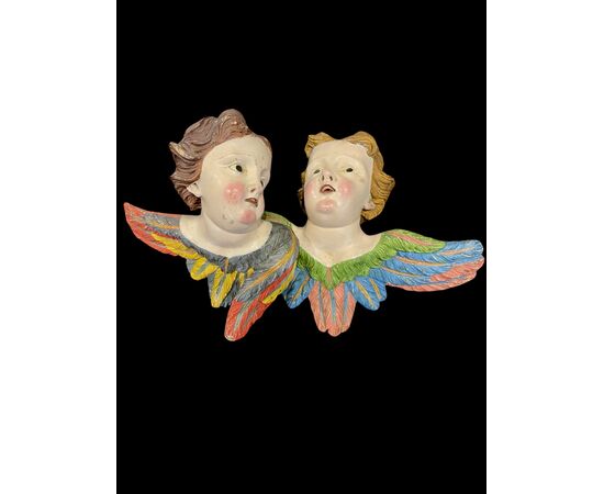 Coppia di Angeli-cherubini in legno intagliato e dipinto. Liguria.