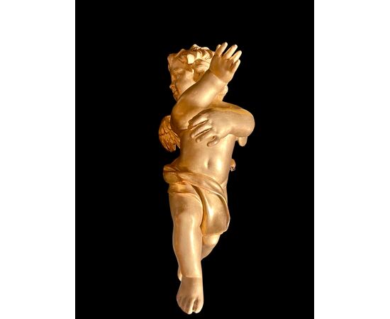 Coppia di angeli-cherubini a figura intera in legno scolpito e foglia oro.Liguria.