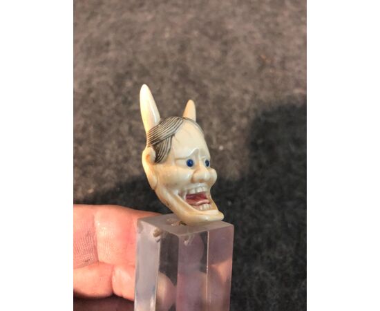 Small ivory head depicting demon.Japan.     