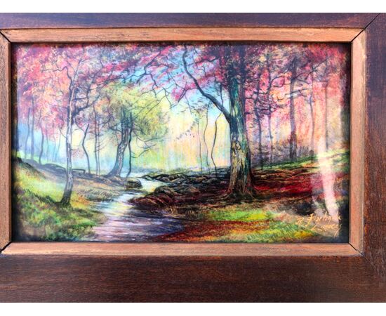 Dipinto in smalto raffigurante paesaggio con fiume.firmato Jules Sarlandie .Limoges Francia.Cornice in legno ebanizzato.