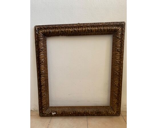 17th century frame in carved wood.     
