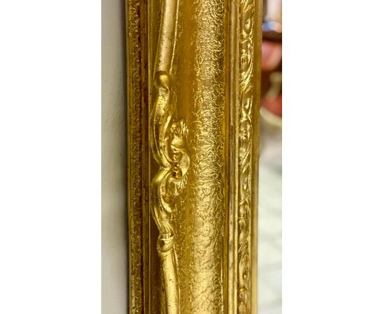 Specchiera lombarda a cabaret in legno intagliato dorato  XIX secolo 