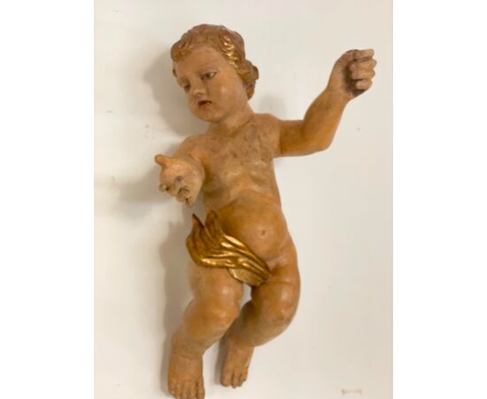 Putto ligneo cherubino scolpito laccato e dorato . XVII secolo Lombardia 