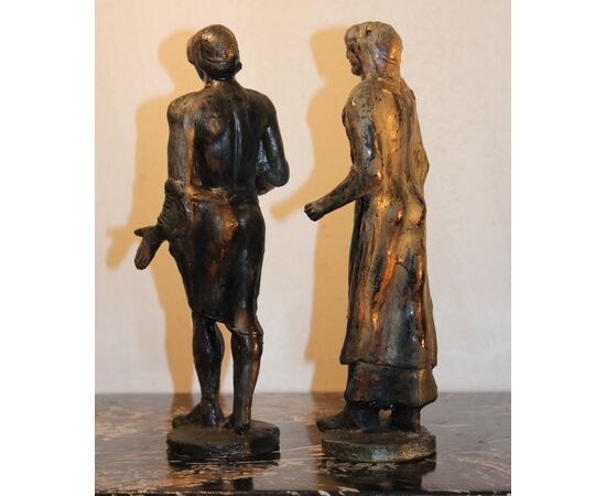 Ceramica Minghetti | Copia in ceramica a patina bronzea di una coppia di figure etrusche .