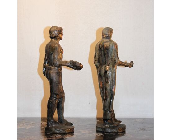 Ceramica Minghetti | Copia in ceramica a patina bronzea di una coppia di figure etrusche .