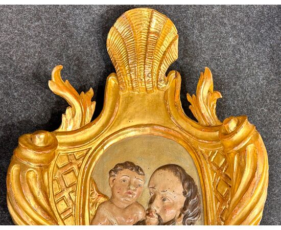 Grande pannello ligneo policromo e dorato "Annunciazione a San Giuseppe" -Inizi del XVII sec. 