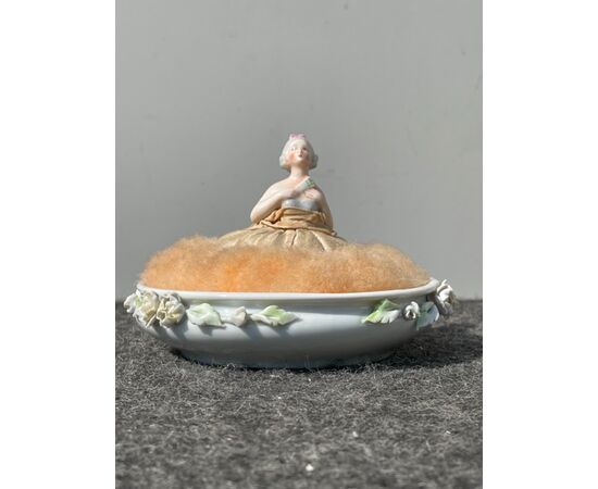 Porcelain half doll powder box with embossed lady figure and flowers. France.     