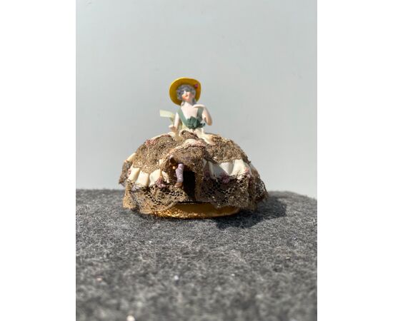 Porcelain half doll powder box with a lady figure. France or Germany.     