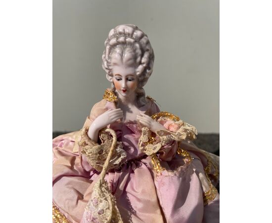 Porcelain half doll powder box with figure of lady with parasol. France or Germany.     