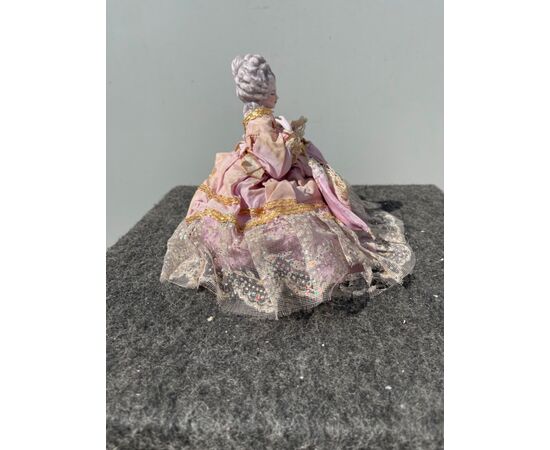 Porcelain half doll powder box with figure of lady with parasol. France or Germany.     