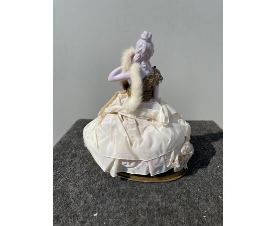 Porcelain half doll powder box with a lady figure with mandolin, porcelain legs, France or Germany.     