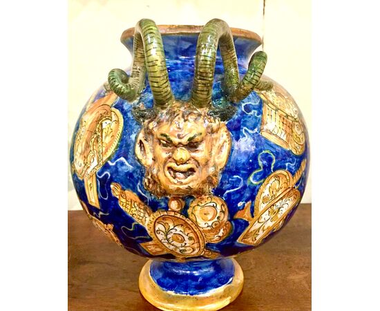 Metallic luster globular vase decorated with trophies in the Casteldurante style with snake and mascaron sockets.Signed and dated 1881.Angelo Minghetti, Bologna.     