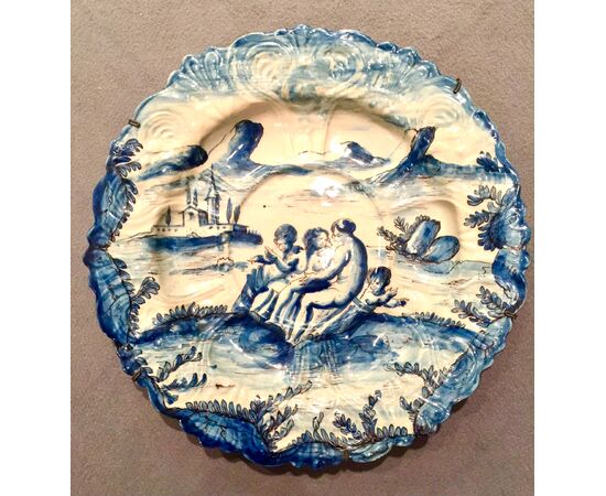 Large majolica plate with turquoise monochrome decoration with characters in a rural setting. Lanterna. Savona signature.     
