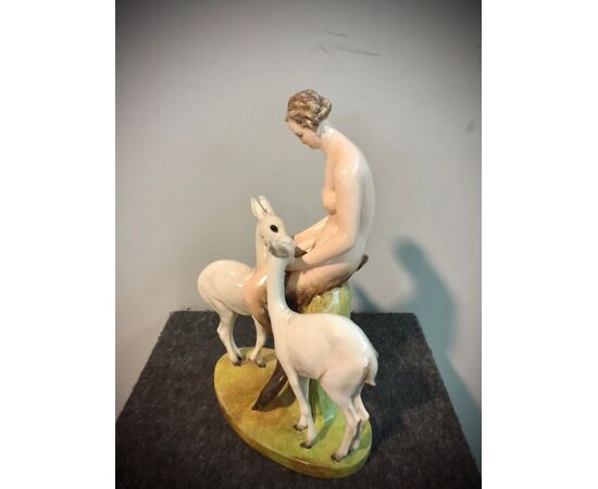 Ceramic group with faun and a pair of fawns. Cacciapuoti manufacture. Milan     