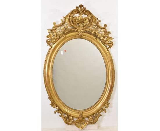 SPECCHIO ANTICO OVALE CON CIMASA, FIORI E VOLUTE, SPECCHIERA  ANTICA, CORNICE DORATA, DEL XIX SECOLO. (SPO171)