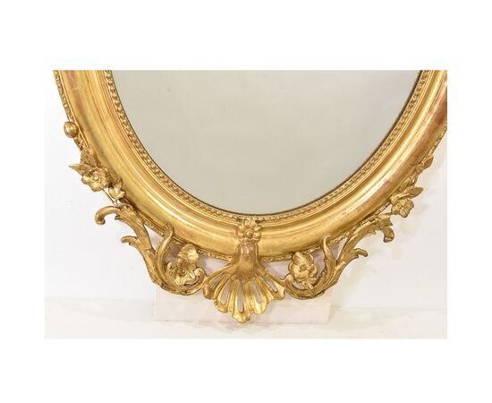 SPECCHIO ANTICO OVALE CON CIMASA, FIORI E VOLUTE, SPECCHIERA  ANTICA, CORNICE DORATA, DEL XIX SECOLO. (SPO171)