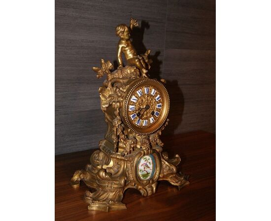 Orologio in bronzo del 1800 con medaglione in porcellana di sevres