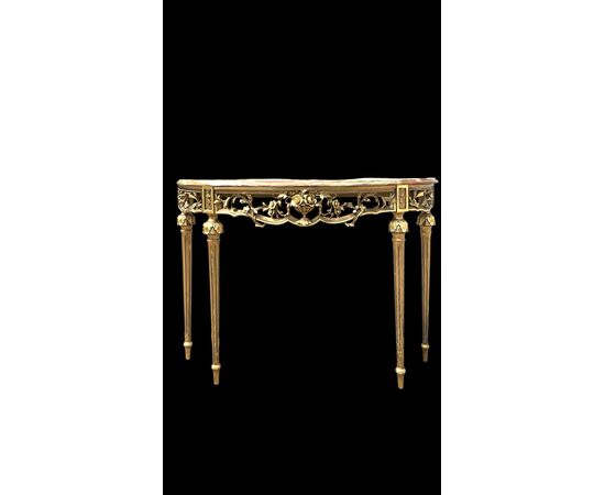 Consolle in legno intagliato e foglia oro con motivi floreali e rocaille .Piano in marmo policromo.Periodo Art Nouveau.