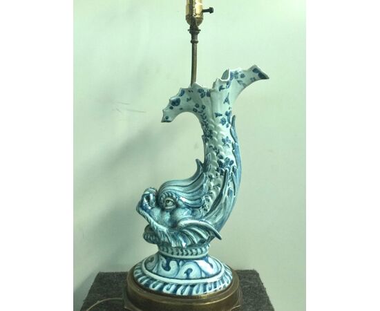 Majolica lamp depicting mythological fish decorated in Savona blue monochrome style.Bronze base.Cantagalli manufacture.Florence.     