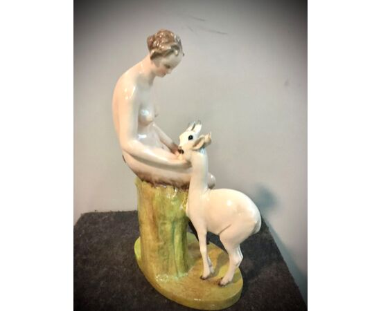 Ceramic group with faun and a pair of fawns. Cacciapuoti manufacture. Milan     