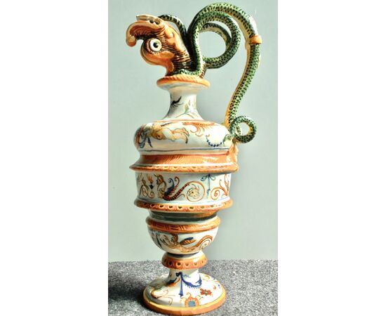 Pair of majolica pouring vessels with snake-shaped sockets, fish spout and Raphaelesque and grotesque decoration.Molaroni, Pesaro.     