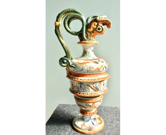 Pair of majolica pouring vessels with snake-shaped sockets, fish spout and Raphaelesque and grotesque decoration.Molaroni, Pesaro.     