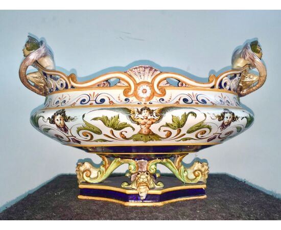 Centerpiece in openwork majolica with octagonal base with grotesque handles and Raphaelesque decoration.Ginori manufacture.     