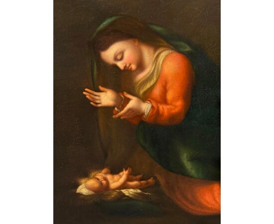 Madonna in Adoration of the Child Jesus, by Correggio.